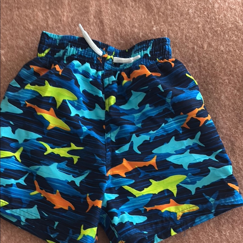 Vibrant Blue and Orange Shark Swim Trunks
